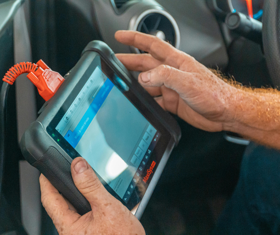 Mechanic Using An Autel MaxiSys Automotive Diagnostic Tablet